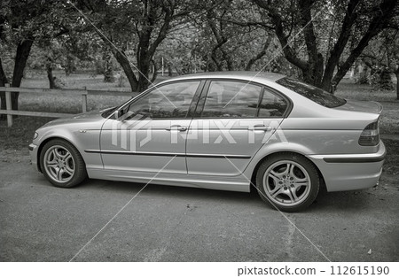 White car with a street background. Modern city car photo 112615190