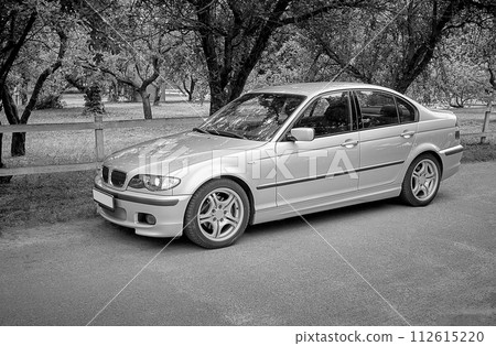White car with a street background. Modern city car photo 112615220