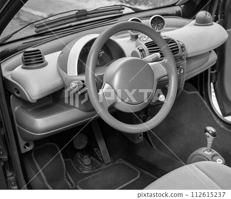 Car steering wheel and interior background, modern city car elements close view. Car inside interior 112615237