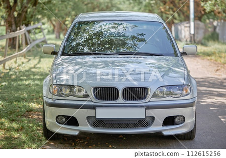 White car with a street background. Modern city car photo White car with a street background. Modern city car photo 112615256
