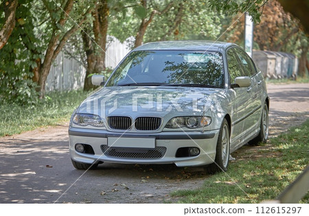 White car with a street background. Modern city car photo 112615297