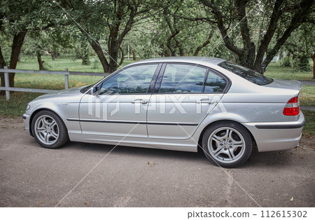 White car with a street background. Modern city car photo 112615302