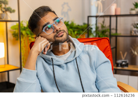 Indian man at home suffers from unfair situation problem, break up, depressed, feeling bad burnout Indian man at home suffers from unfair situation problem, break up, depressed, feeling bad burnout 112616236