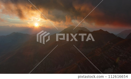 Sunset mountains and dramatic clouds 112616654