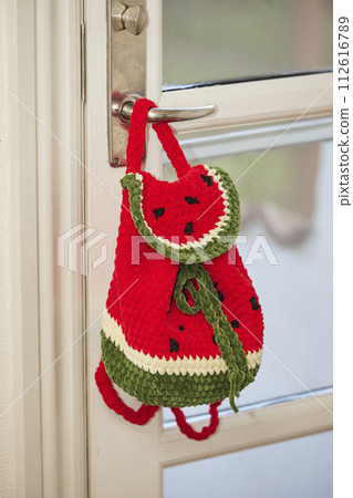 Charming knitted backpack in the shape of a watermelon Charming knitted backpack in the shape of a watermelon 112616789