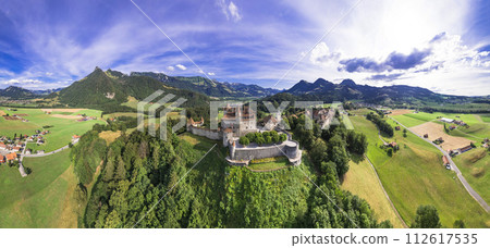 Switzerland travel and landmarks. scenic medieval village and castle Gruyere. canton Fribourg. Aerial panoramic drone view Switzerland travel and landmarks. scenic medieval village and castle Gruyere. canton Fribourg. Aerial panoramic drone view 112617535