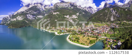 Most scenic mountain lakes in northern Italy - beautiful Molveno in Trento, Trentino Alto Adige region. panoramic aerial drone high angle view.. 112617538