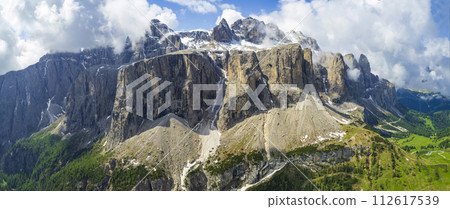 Breathtaking panorama of beautiful Alps mountains Dolomites, Val Gardena. Aerial drone panoramic view . northern Italy. Alpine nature scenery. Breathtaking panorama of beautiful Alps mountains Dolomites, Val Gardena. Aerial drone panoramic view . northern Italy. Alpine nature scenery. 112617539