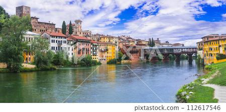 Beautiful medieval towns of Italy -picturesque Bassano del Grappa .Scenic view with famous bridge. Vicenza province, region of Veneto. Beautiful medieval towns of Italy -picturesque Bassano del Grappa .Scenic view with famous bridge. Vicenza province, region of Veneto. 112617546