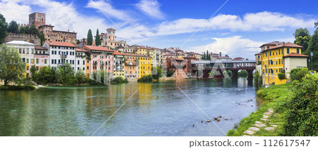 Beautiful medieval towns of Italy -picturesque Bassano del Grappa .Scenic view with famous bridge. Vicenza province, region of Veneto. Beautiful medieval towns of Italy -picturesque Bassano del Grappa .Scenic view with famous bridge. Vicenza province, region of Veneto. 112617547