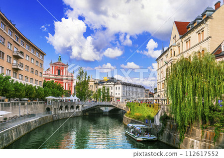 Travel and landmarks of Slovenia - beautiful Ljubljana capital city, scenic canals in downtown. 112617552