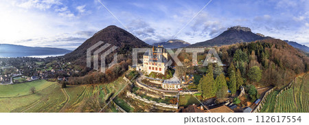Most beautiful medieval castles of France - fairytale Menthon located near lake Annecy. aerial panoramic view. Most beautiful medieval castles of France - fairytale Menthon located near lake Annecy. aerial panoramic view. 112617554