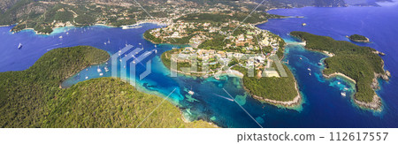 Sivota - stunning aerial drone video of turquoise sea known as Blue Lagoon and white sandy beaches. Epirus, Greece summer holidays 112617557