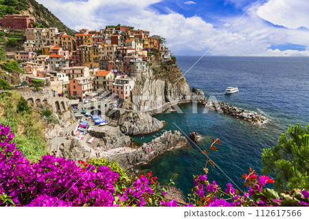 Italy travel and landmarks. . Colorful fishing village Manarola- National Park "Cinque terre" in Liguria, popular tourist destination. 112617566