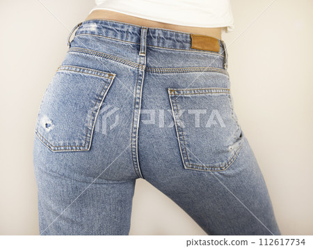 Close up of buttocks in blue jeans. Concept of a sexy woman in jeans. 112617734