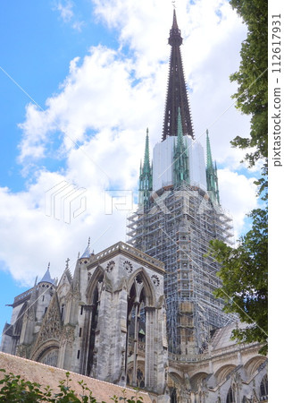 Rouen Cathedral towering high in the sky under clear skies 112617931