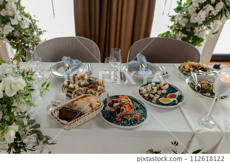 Elegant wedding floral arrangement with candles Elegant wedding floral arrangement with candles 112618122