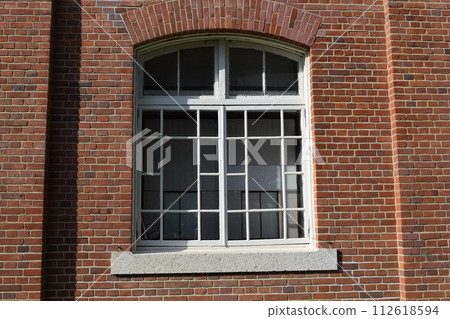 white window frame red brick wall white window frame red brick wall 112618594