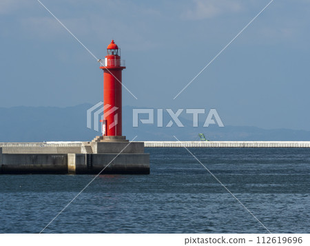 A red lighthouse on the breakwater of Osaka Port A red lighthouse on the breakwater of Osaka Port 112619696