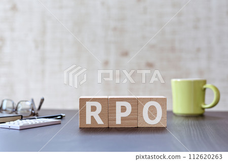There is a wood cube with the word RPO on it. It stands for Recovery Point Goal as an eye-catching image. 112620263