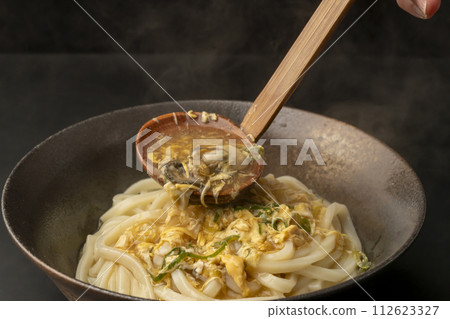 Oyster egg ankake udon with a ladle for filling Oyster egg ankake udon with a ladle for filling 112623327