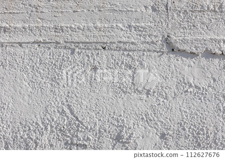 rough whitewash or white plaster wall under direct sunlight, full-frame background and texture rough whitewash or white plaster wall under direct sunlight, full-frame background and texture 112627676