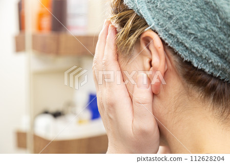 A young woman doing skin care A young woman doing skin care 112628204