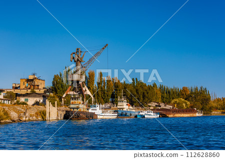 old abandoned soviet Port Balykchy on Issyk-Kul lake at sunny autumn afternoon 112628860