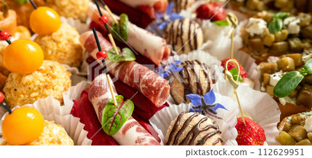 Catering service. Set of beautiful canapes. Buffet table. Shallow depth of view. Catering service. Set of beautiful canapes. Buffet table. Shallow depth of view. 112629951