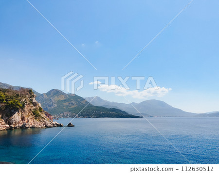 Top view Montenegro Sutomore stones beach blue turquoise Adriatic sea water mountains day 112630512