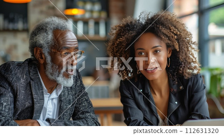 Man Sitting at Table Talking to Woman Man Sitting at Table Talking to Woman 112631320