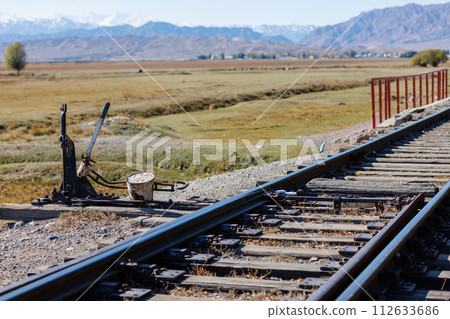 manual railroad switch with lever and counterweight at summer day manual railroad switch with lever and counterweight at summer day 112633686