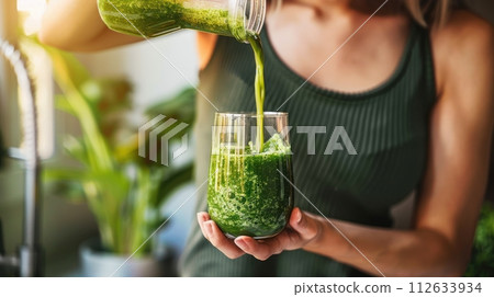 Detox juice, Hand of woman pouring vegetable smoothie, healthy meal food for weight loss 112633934