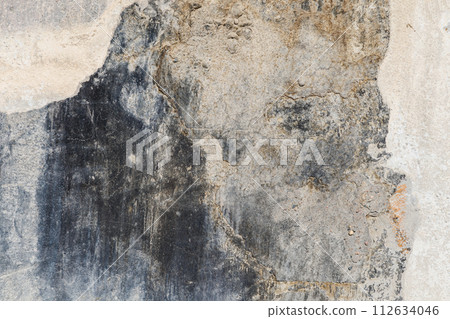 old concrete wall with black paint leftovers covered with whitewash stains, full-frame background and texture old concrete wall with black paint leftovers covered with whitewash stains, full-frame background and texture 112634046