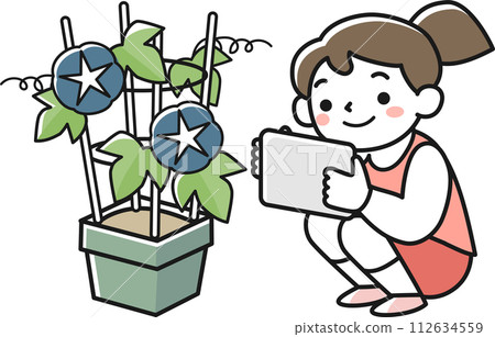 A girl records her observations of morning glories on a tablet. 112634559