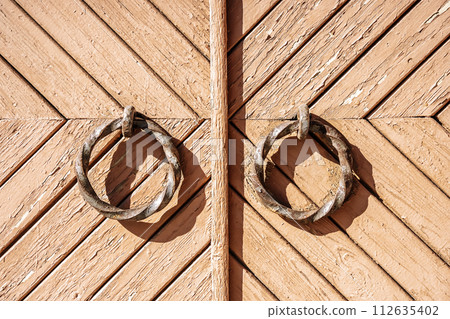 Old barn gate. Wooden rustic gate for a warehouse, stable or barn 112635402
