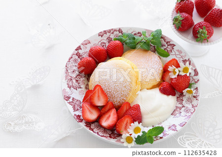 Spring pancakes with strawberries and fresh cream Spring pancakes with strawberries and fresh cream 112635428
