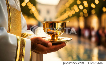 Close-up of Hands of a Priest Holding a Golden Chalice - Generative Ai 112635602