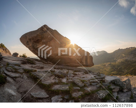 Giant balancing rock above the cliff. Giant balancing rock above the cliff. 112637898