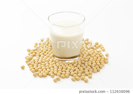Soy milk and soybeans on white background Soy milk and soybeans on white background 112638096