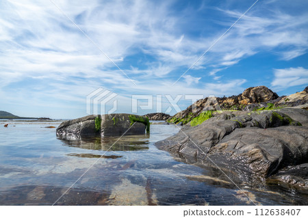 The rocks of Carrickfad by Portnoo at Narin Strand in County Donegal Ireland 112638407
