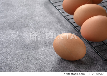 Chicken eggs in on Cooking Table 112638565