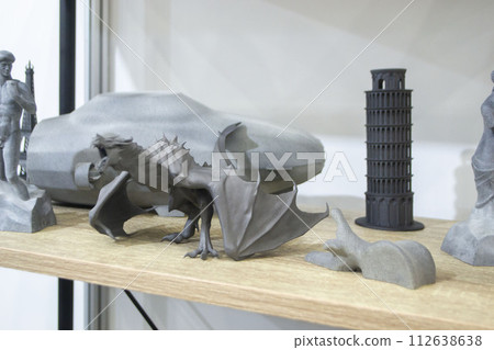 Many different art models from polyamide powder printed on 3D printer. Technology Multi Jet Fusion MJF. Three-dimensional model printed 3D printer from plastic. Additive progressive powder technology 112638638