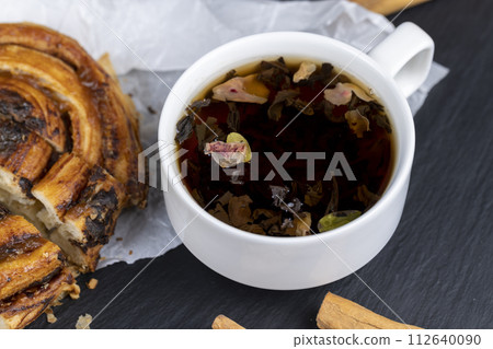 sweet delicious puff pastry with chocolate pieces in caramel 112640090