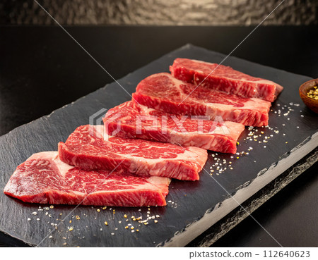 Delicious fresh raw meat of Kuroge Wagyu beef on a plate (AI generated image) 112640623