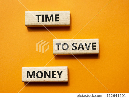 Time to save money symbol. Wooden blocks with words Time to save money. Beautiful orange background. Business and Time to save money concept. Copy space. 112641201