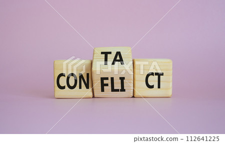 Contact and Conflict symbol. Wooden cubes with words Contact and Conflict. Beautiful pink background. Contact and Conflict and business concept. Copy space Contact and Conflict symbol. Wooden cubes with words Contact and Conflict. Beautiful pink background. Contact and Conflict and business concept. Copy space 112641225