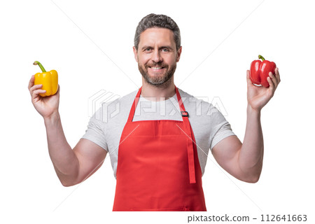 man in apron with sweet pepper vegetable isolated on white man in apron with sweet pepper vegetable isolated on white 112641663