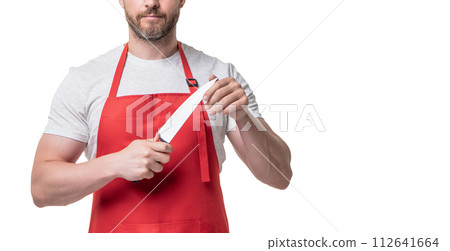 cropped view of butcher in red apron hold knife isolated on white background cropped view of butcher in red apron hold knife isolated on white background 112641664