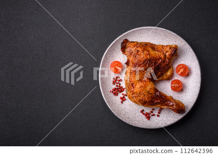Delicious grilled chicken leg or quarter with salt and spices Delicious grilled chicken leg or quarter with salt and spices 112642396